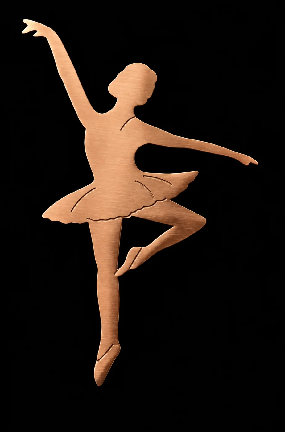 Brushed copper cutout silhouette of a ballerina in arabesque on black